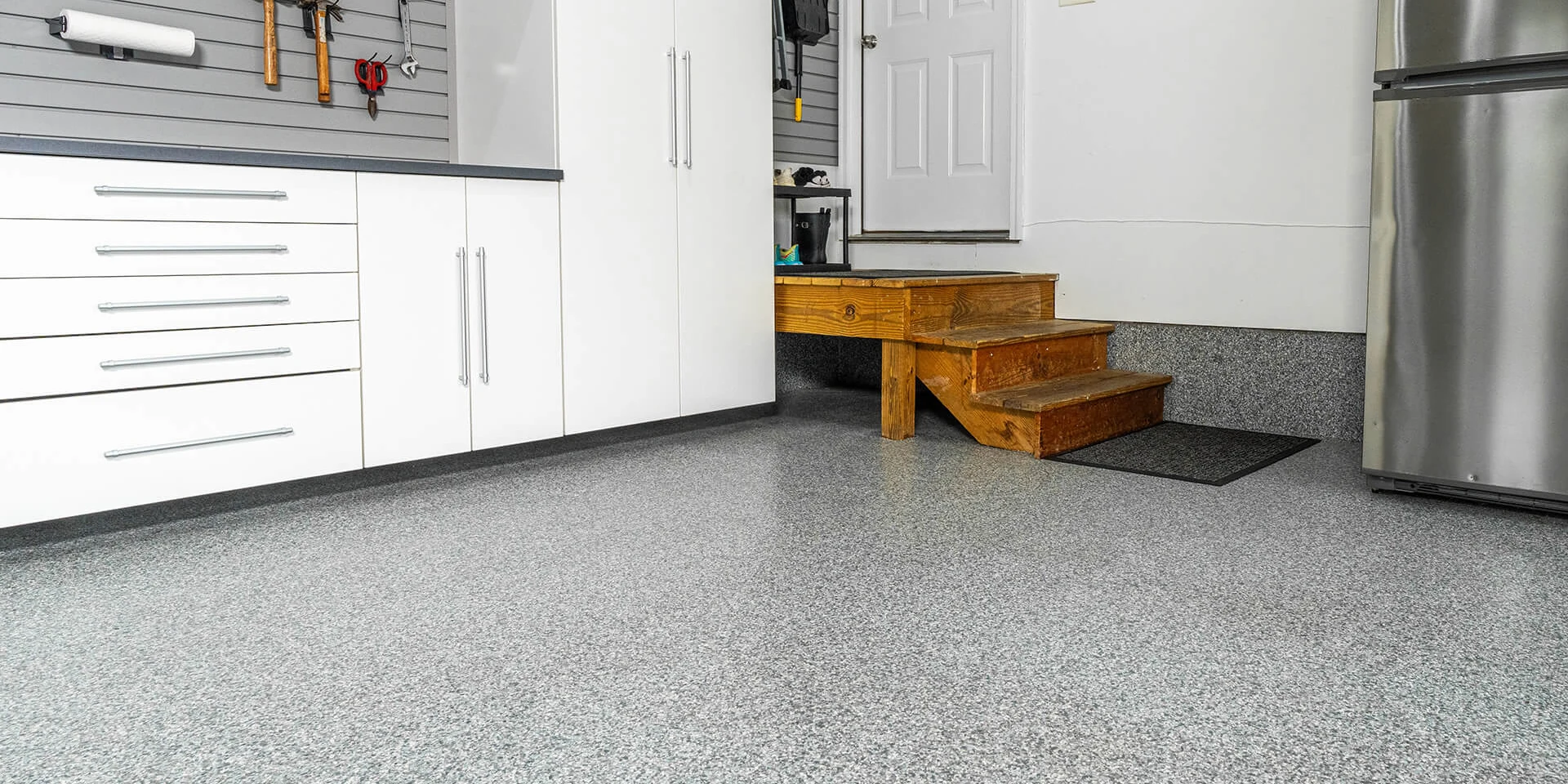 A finished gray flake garage floor.